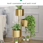 Gold metal indoor planters with green plants in a modern living room setting.