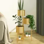 Gold metal indoor planters with green plants in a modern living room setting.