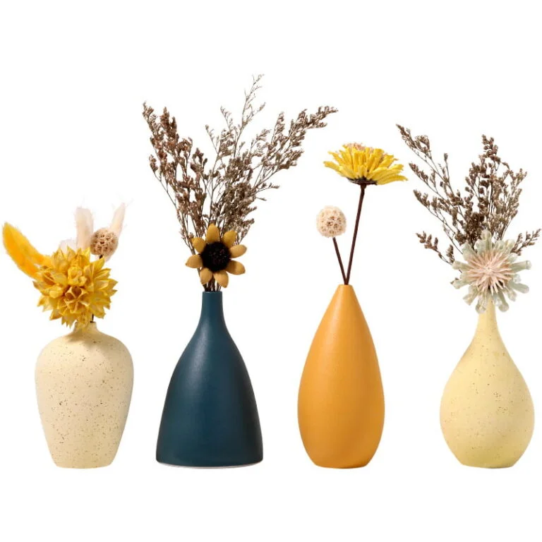 Set of four decorative vases with dried flowers in modern colors.