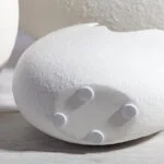 Modern white decorative sculpture with textured surface