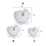 Set of three modern white ceramic vases with unique abstract design.