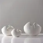 Modern white ceramic vases in abstract shapes for luxury home decor