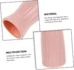 Pink ceramic vase with ribbed texture for modern home decor.