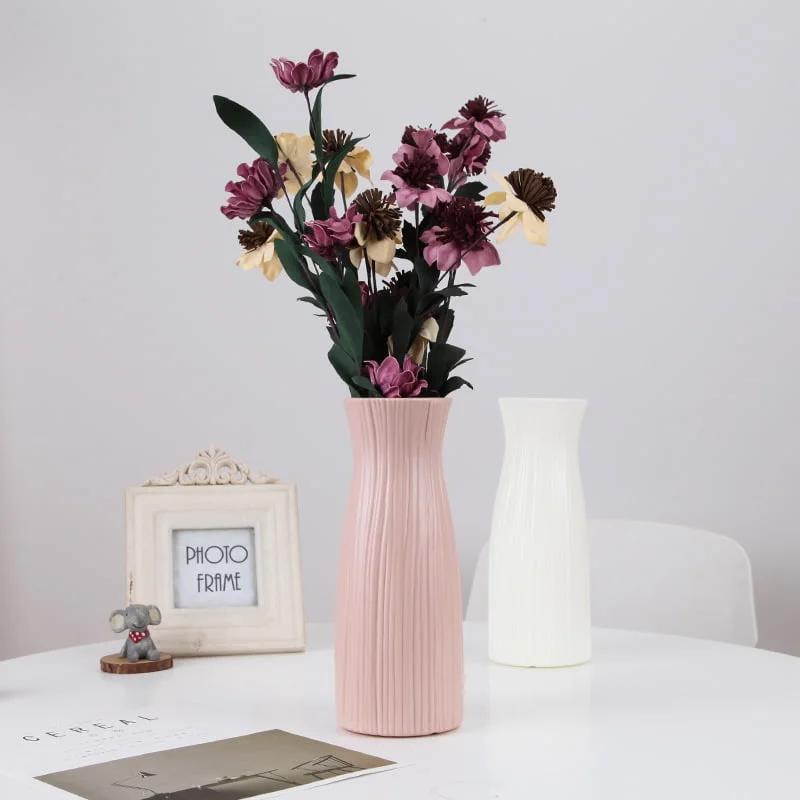 Modern Ceramic Vases with Flowers Elegant pink and white ceramic vases with flowers on a modern table.