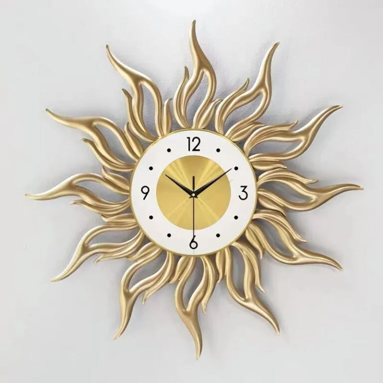 Luxury sunburst wall clock in gold, modern home decor.