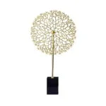Gold decorative sculpture on black base, modern home decor accessory.