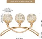 Gold decorative candle holder with crystal accents, modern home decor accessory.