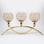 Elegant gold candle holder with crystal accents, perfect for luxury home decor.