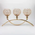 Elegant gold candle holder with crystal accents, perfect for luxury home decor and table centerpieces.