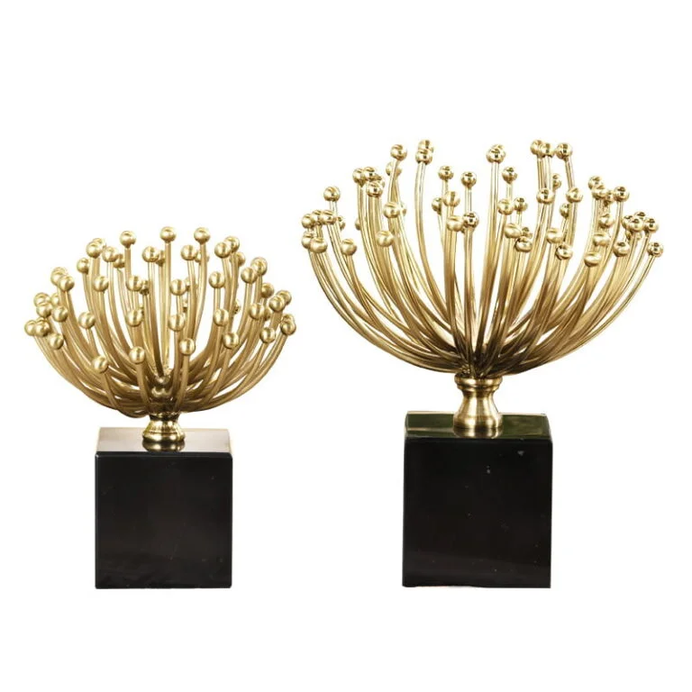 Gold decorative sculptures on black bases for modern home decor