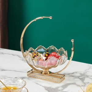 Elegant gold and crystal decorative bowl on marble table, modern home decor accessory.