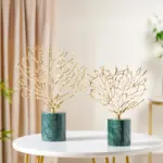 Gold decorative sculptures on a marble base, modern home decor.