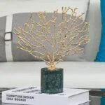 Gold coral sculpture on a marble base, modern home decor accessory.