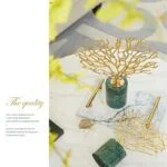 Luxury gold decorative ornaments on marble base for modern home decor.