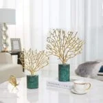 Elegant gold coral sculptures on a marble base, modern home decor centerpiece.