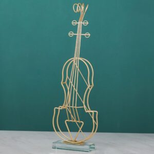 Gold wire violin sculpture on a glass base, modern home decor accessory.