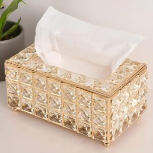 Luxury crystal tissue box with gold accents on a modern decor table.
