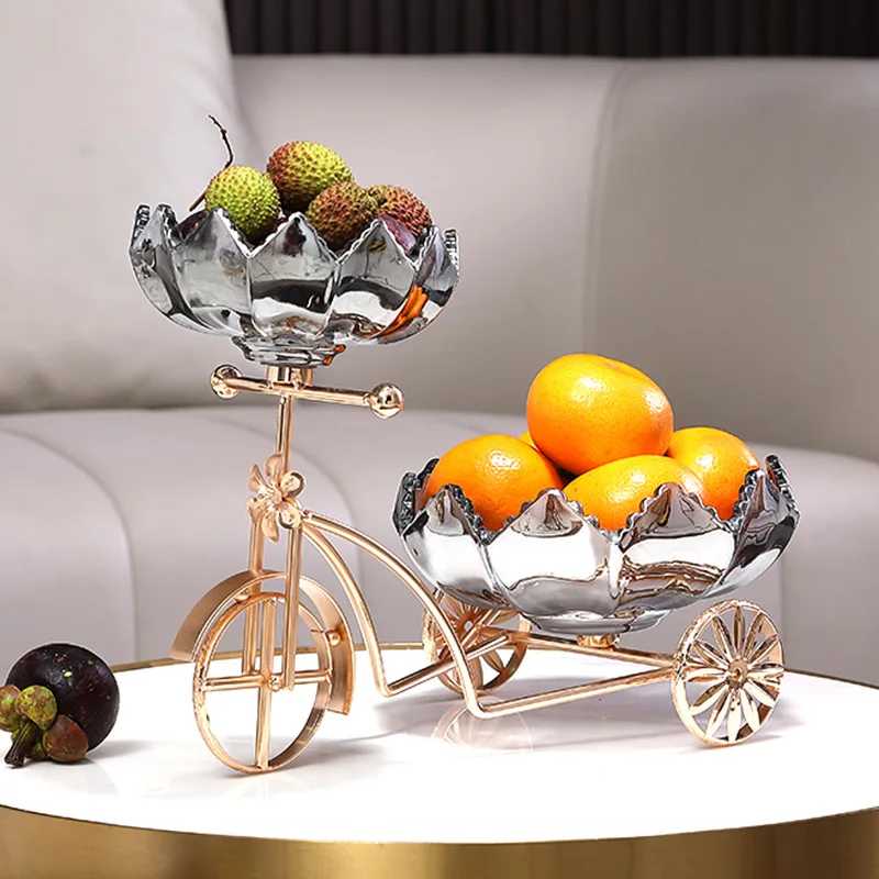 Luxury decorative fruit holder in a bicycle design on a modern table.