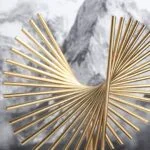 Modern gold decorative sculpture with a spiral design, perfect for luxury home decor.