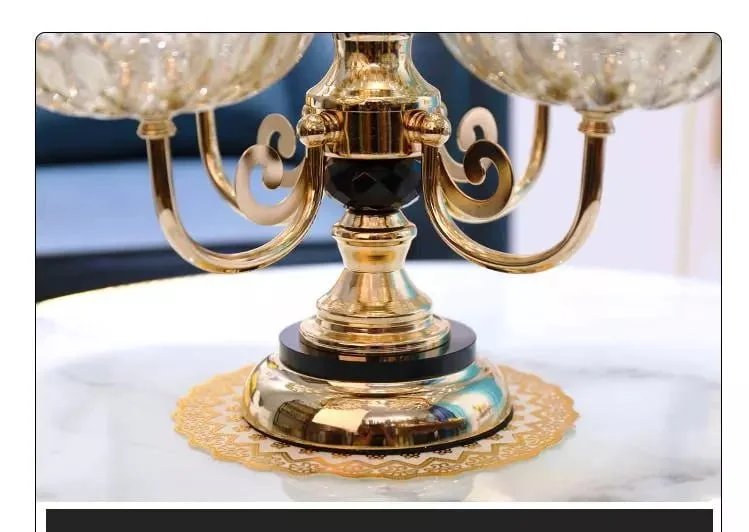 Elegant gold decorative ornament on a marble table, luxury home decor.