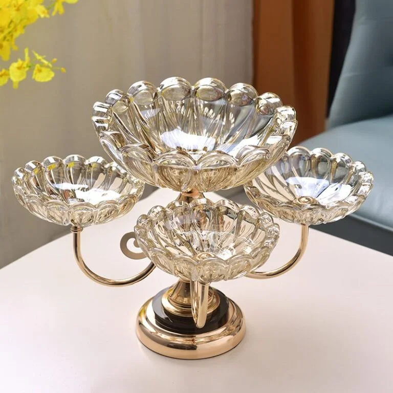 Elegant crystal decorative centerpiece with gold accents on a table.