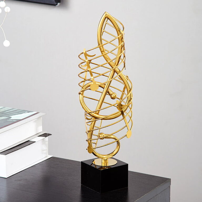 Gold decorative sculpture on black base, modern home decor accessory.