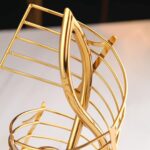 Elegant gold decorative sculpture with modern design for luxury home decor.