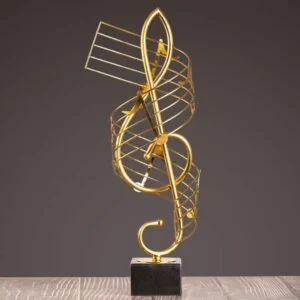 Gold decorative sculpture on a black base, modern home decor accent.
