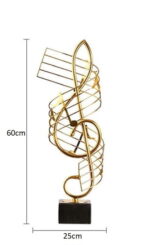 Gold decorative sculpture with musical note design on black base, 60cm tall.