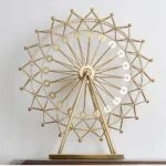 Gold decorative Ferris wheel sculpture for modern home decor.