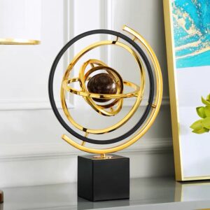 Modern luxury decorative sculpture with gold and black rings on a black base, perfect for home decor.