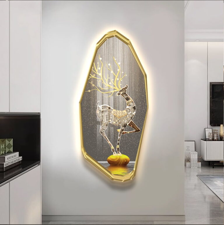 Illuminated deer wall art with gold frame in modern living room decor.