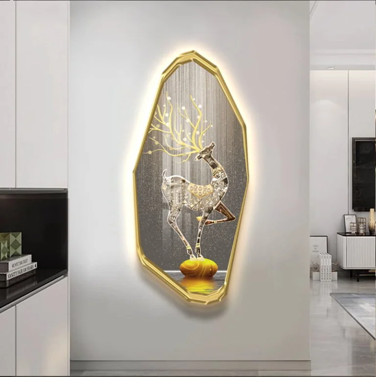 Illuminated deer wall art with gold frame in modern living room decor.