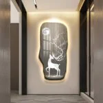 Illuminated wall art with deer and moon design in modern hallway decor.