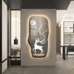 Illuminated wall art featuring a deer and moon design in a modern home setting.