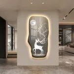Illuminated wall art with deer and moon design in modern living room.