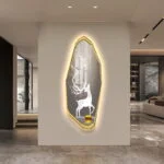 Modern LED wall art with deer silhouette and gold frame in a luxury living room.