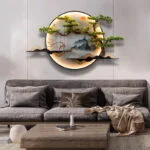 Modern illuminated wall art with nature scene above a gray sofa in a stylish living room.