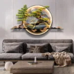 Modern illuminated wall art with nature scene above a grey sofa in a stylish living room.