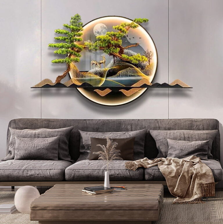 Modern illuminated wall art with nature scene above a grey sofa in a stylish living room.