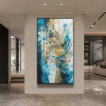 Modern luxury wall art with blue and gold abstract design in a sleek living room.