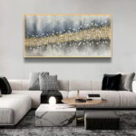 Modern luxury living room with abstract framed wall art and elegant decor.