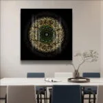 Modern Islamic wall art with Arabic calligraphy and gold accents in a dining room setting.