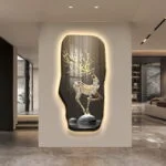 Illuminated modern wall art with a deer design in a luxury home setting.