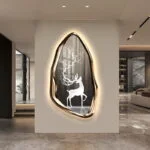 Modern illuminated wall art with deer design in luxury home setting.