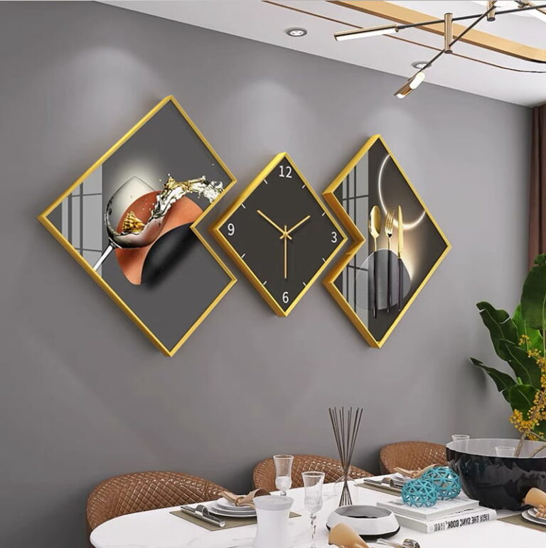 Modern luxury wall art and clock set with gold frames in a dining room.