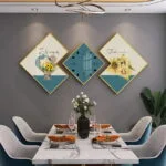 Modern dining room with geometric wall art and decorative wall clock.