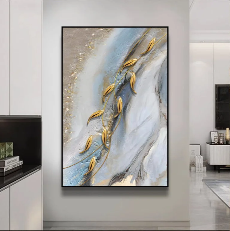Modern abstract wall art with gold accents in a luxury home setting.