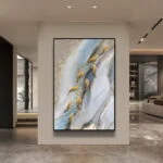 Modern luxury wall art with abstract design and gold accents in a contemporary living room.