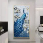 Elegant blue peacock wall art with floral accents in a modern home setting.